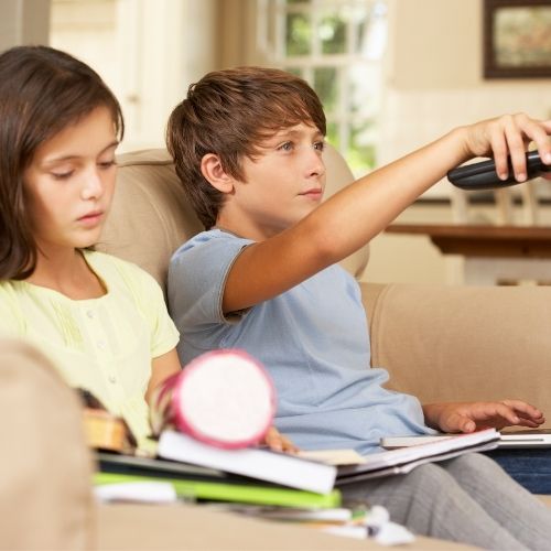 Two children watching TV