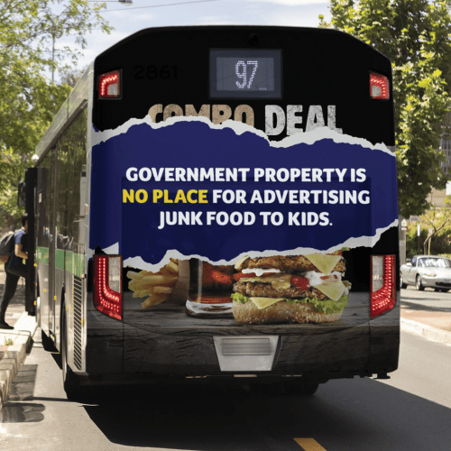 View of the back of a bus with the words 'government property is no place for advertising junk food to kids'