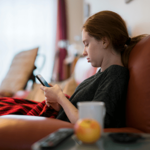 Teenage girl looking at a mobile phone